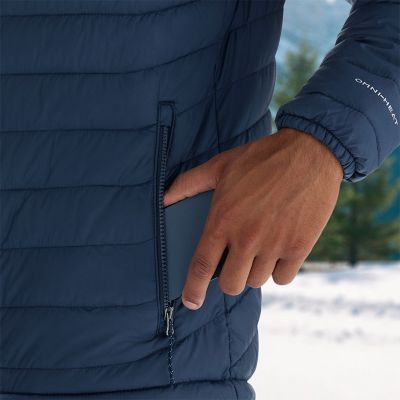 Model placing a phone into the zippered hand pocket.