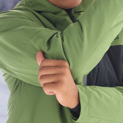 Close-up of the model showing the stretchiness of the jacket arms.