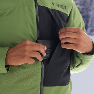 Close-up of a model putting a wallet in the internal pocket.