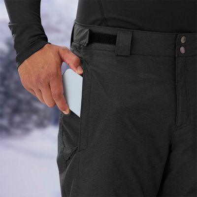Model placing a phone into the zippered leg pocket.