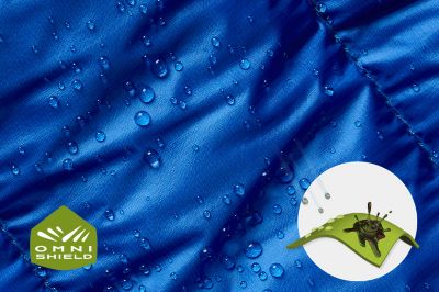Close up of fabric with the Omni Shield logo in the bottom left and a graphic showing how moisture beads on the fabric's surface.