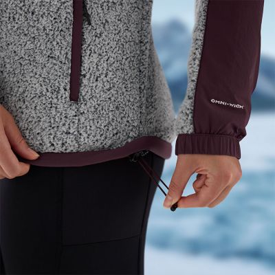 Model either taking off or putting on the included belt.