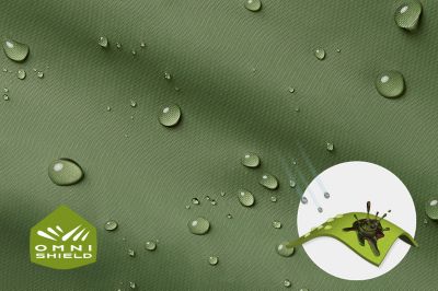 Close up of fabric with the Omni Shield logo in the bottom left and a graphic showing how moisture beads on the fabric's surface.