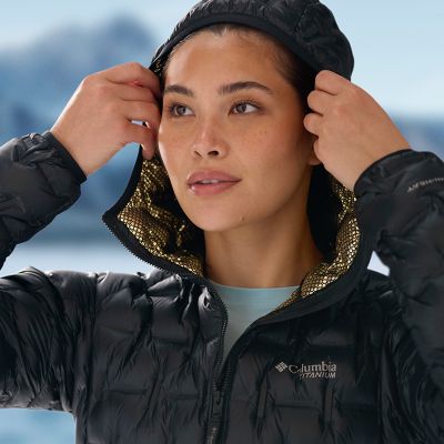 Close-up of a model putting up the hood.
