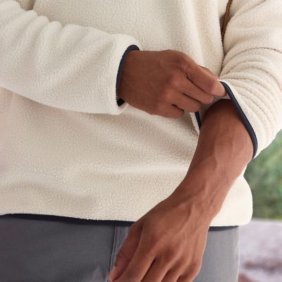 Model adjusting the binding on their cuffs.