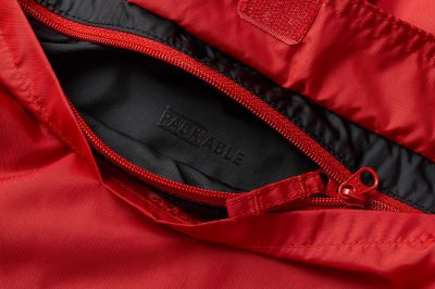 Close-up of unzipped packable pocket.