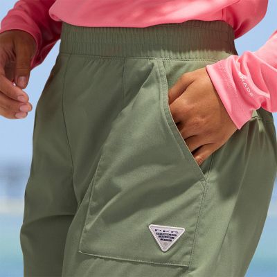 Close-up of a woman putting her hand into the pocket.