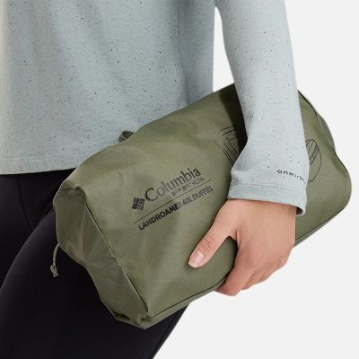 A duffel bag packed down into an exterior pocket.