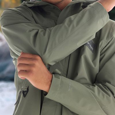 Close-up of model showcasing articulated sleeves and stretchy fabric.