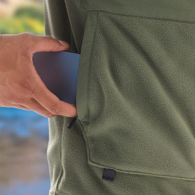 Model putting phone in pocket.