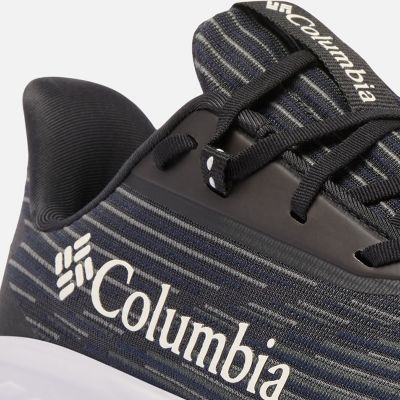 Close-up of a model tying the laces of their running shoes.