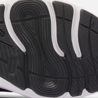 Close-up of a model revealing the bottom traction of their shoes.