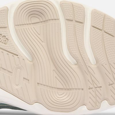 Close-up of a model revealing the bottom traction of their shoes.