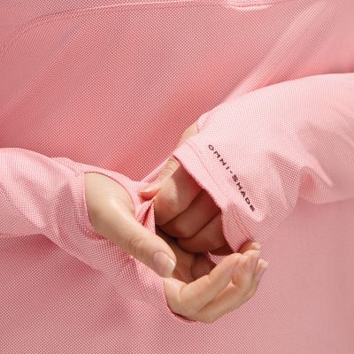 Model adjusting extended thumbhole cuffs over their hand.