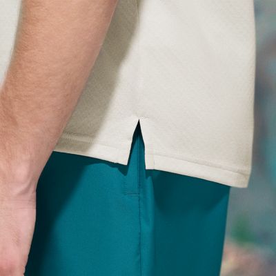 Close-up of the breathable vents and dropped hem.