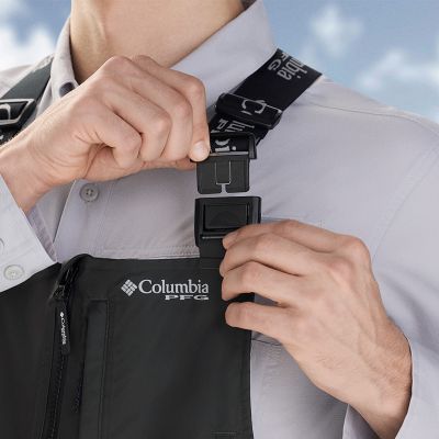 Close-up of a woman buttoning a Silver Ridge shirt. 