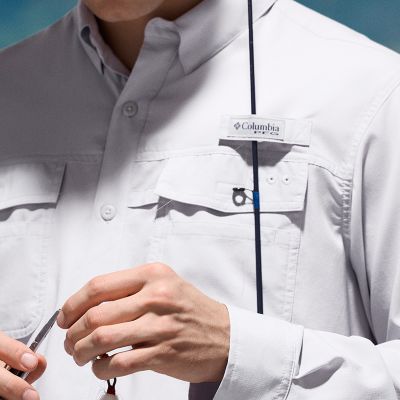 Close-up of a model utilizing the rod-holder loop function of their shirt.
