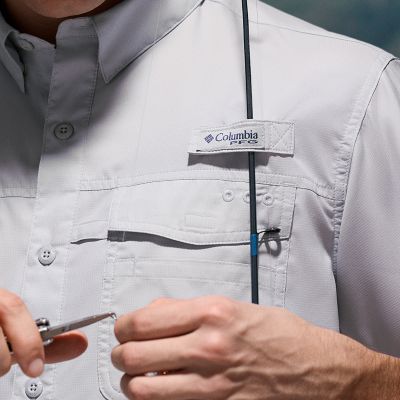 Close-up of a model utilizing the rod-holder loop function on the shirt.