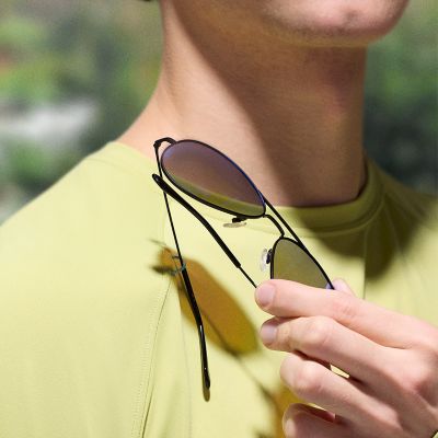 Close-up of sunglasses on a carrying loop.
