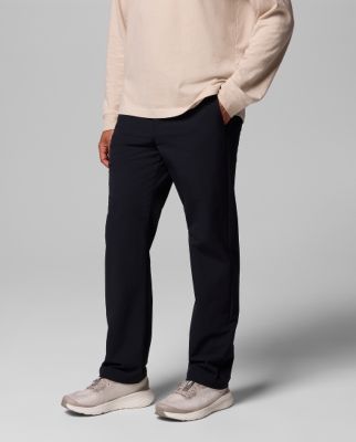 Waist-down image of a man wearing blue shorts and slip-on shoes.