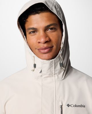 A man wearing a blue rain jacket.