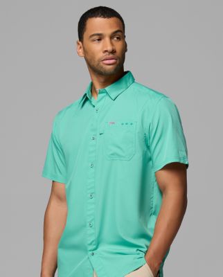 A man wearing a yellow button-up shirt.