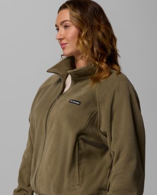 A woman wearing a pink fleece jacket.