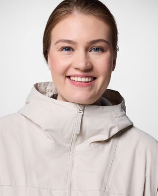 A woman wearing a floral print rain jacket.