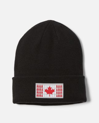 Flatlay of a black beanie with a Canada flag graphic on the front.