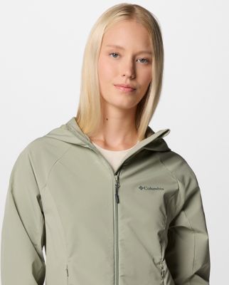 A woman wearing a green softshell jacket.