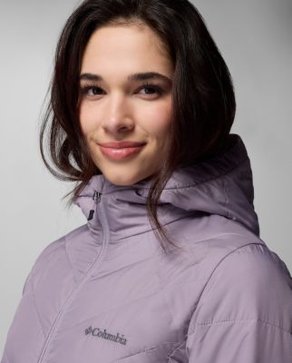 A woman wearing a multi-color jacket.