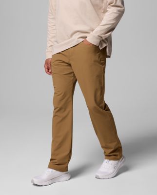 A leg down image of a man wearing black shorts.