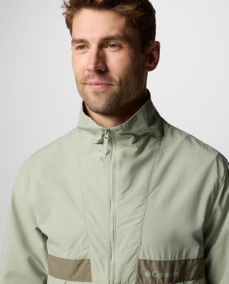 A man wearing a multi-color jacket.