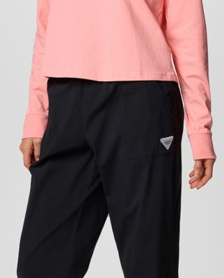 A woman wearing coral bottoms.