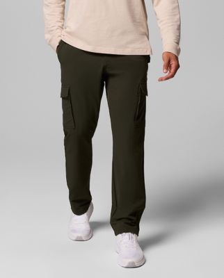 Waist-down image of a man wearing printed shorts and sneakers.