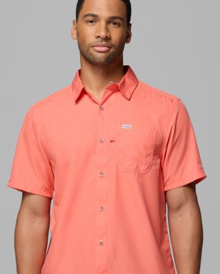 A man wearing a yellow button-up shirt.