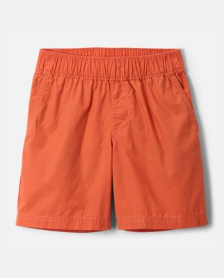 Flatlay of orange shorts.