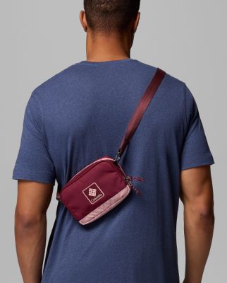 A tan baseball hat with a mountain graphic on the front.