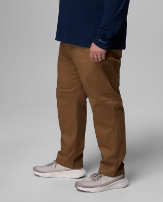 Waist-down image of a man wearing black shorts and white sneakers.