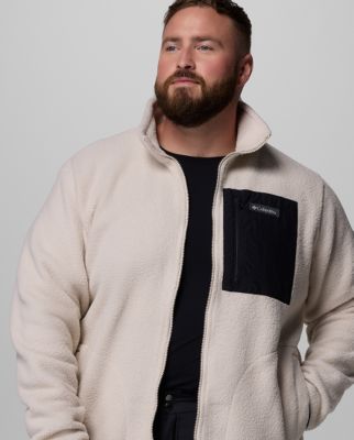 A man wearing a teal fleece jacket.