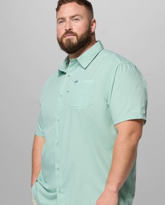A man wearing an orange polo.