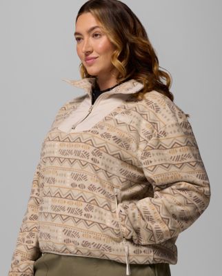A woman wearing a pink fleece jacket.