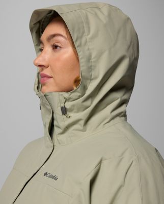 A woman wearing a floral print rain jacket.