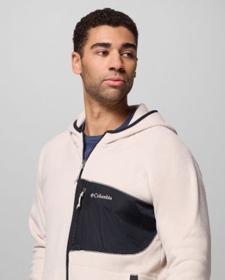 A man wearing an orange fleece zip-up.
