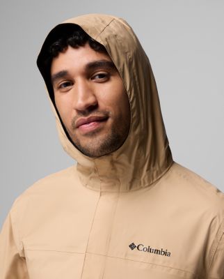 ⁨Man wearing a white rain jacket.