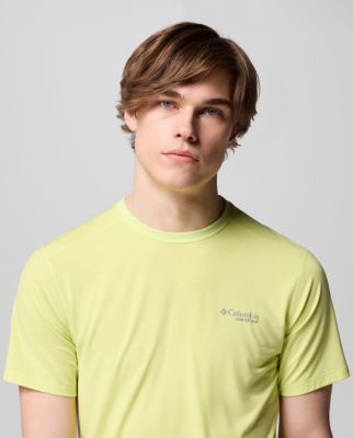 Man wearing a navy short-sleeve shirt.