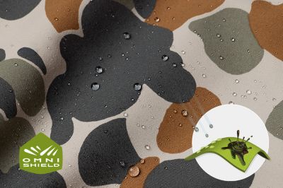 Close up of fabric with the Omni Shield logo in the bottom left and a graphic showing how moisture beads on the fabric's surface.
