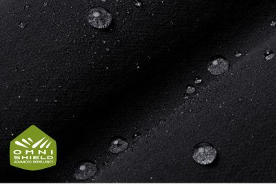 Macro of fabric showing water droplets beading.