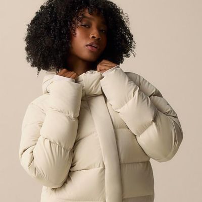 A woman in the white Amaze Puff jacket.