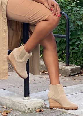 Raquel Willis wearing Joan Uptown Chelsea wedges in an urban setting